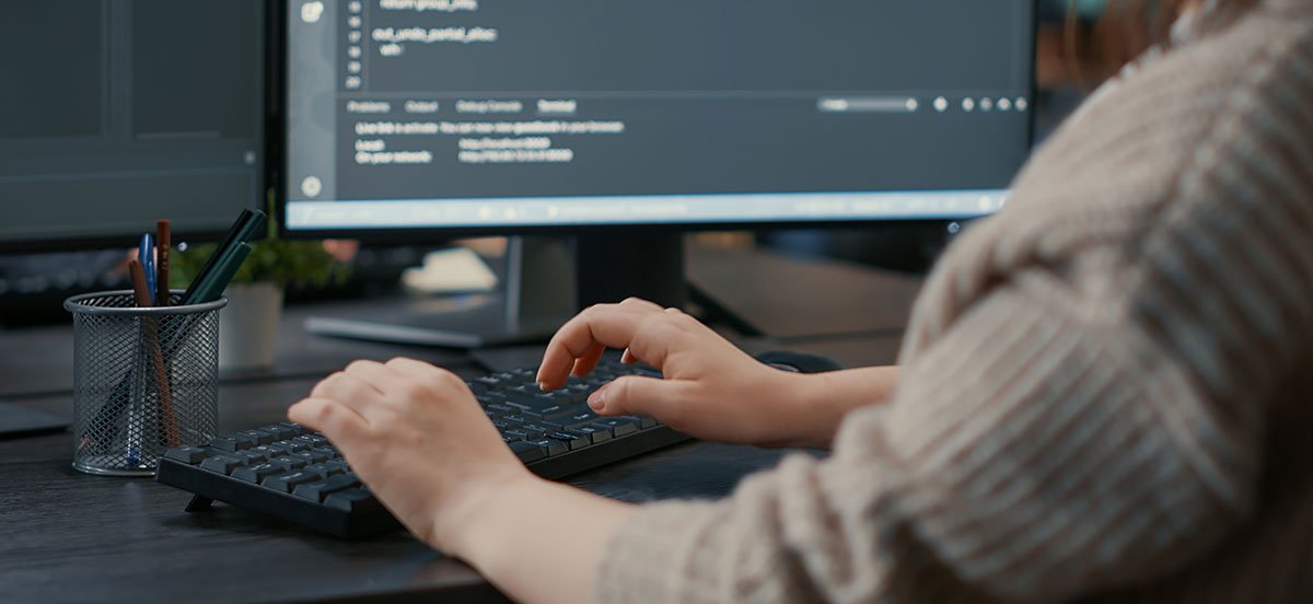 a person typing on a keyboard